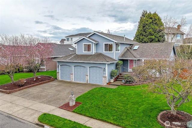 view of front facade featuring concrete driveway and a front yard