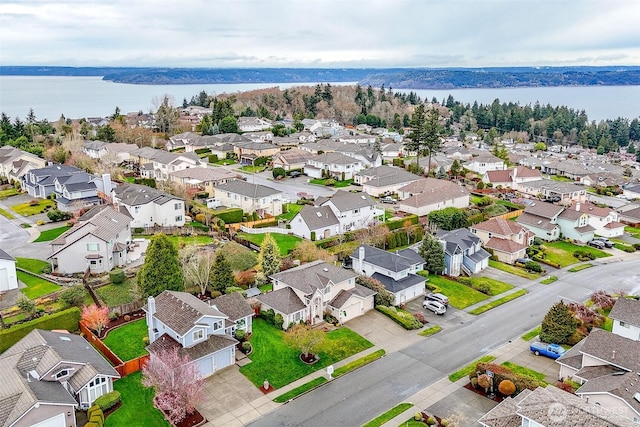 aerial view with a residential view and a water view