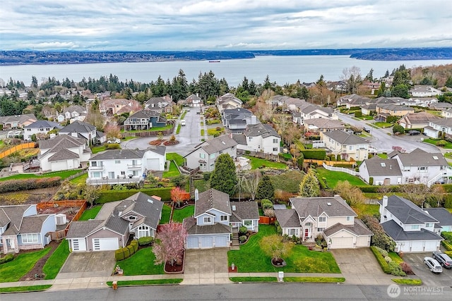 aerial view featuring a residential view and a water view