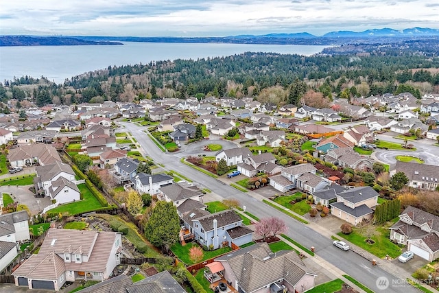 bird's eye view with a residential view and a water view