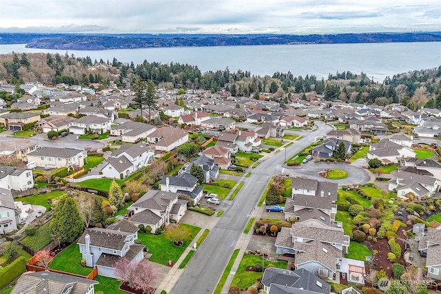 aerial view with a residential view and a water view