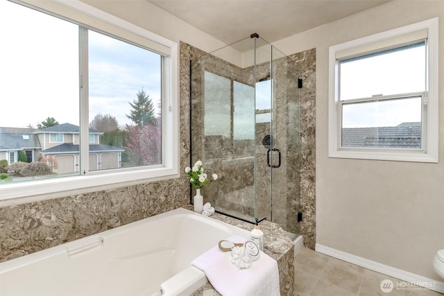 full bath with toilet, a shower stall, tile patterned flooring, baseboards, and a bath