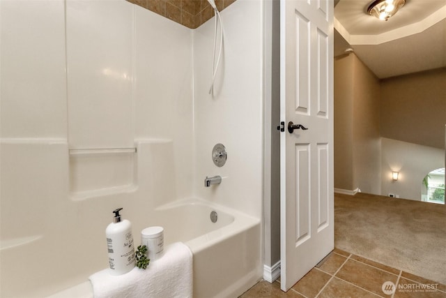 bathroom featuring tile patterned flooring and shower / bath combination