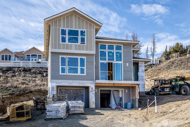 view of front of home with a garage and board and batten siding