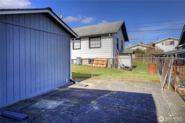 exterior space featuring a lawn and fence