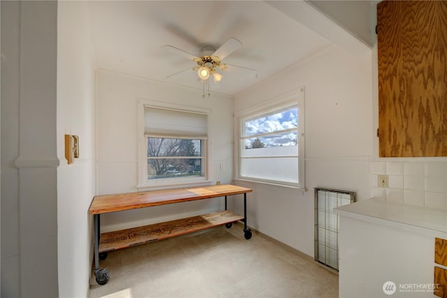 dining space with a ceiling fan