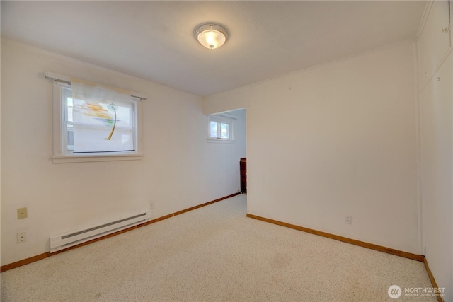 empty room with baseboards, baseboard heating, and carpet flooring