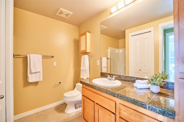 full bathroom with vanity, baseboards, walk in shower, tile patterned floors, and toilet