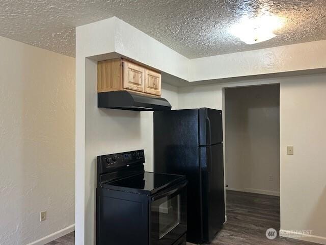 kitchen with under cabinet range hood, light brown cabinetry, black electric range, dark wood-style floors, and a textured ceiling