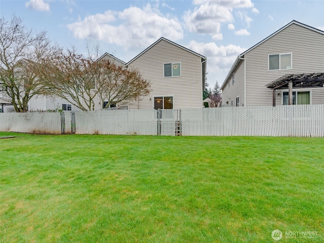 view of yard with a fenced backyard and a pergola