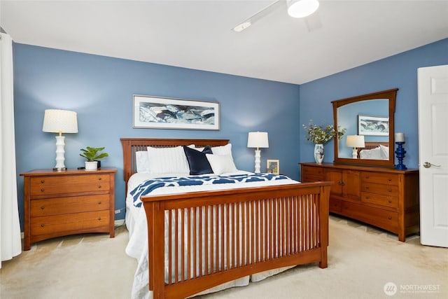 carpeted bedroom featuring a ceiling fan