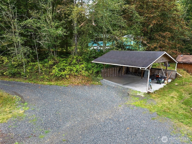 exterior space with a carport and driveway