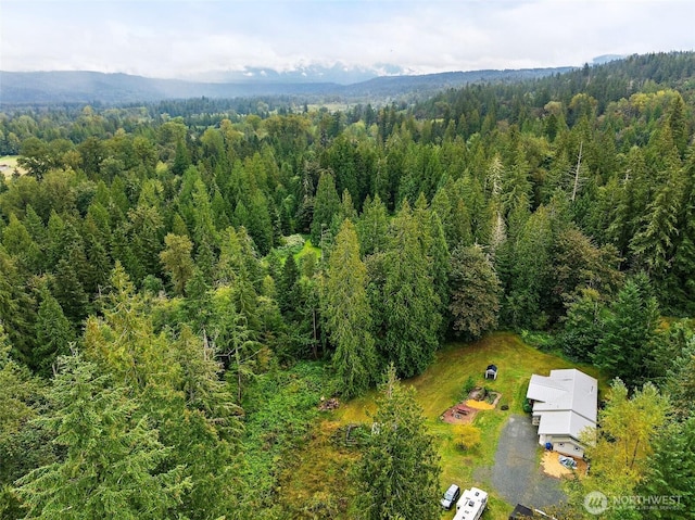 bird's eye view featuring a forest view