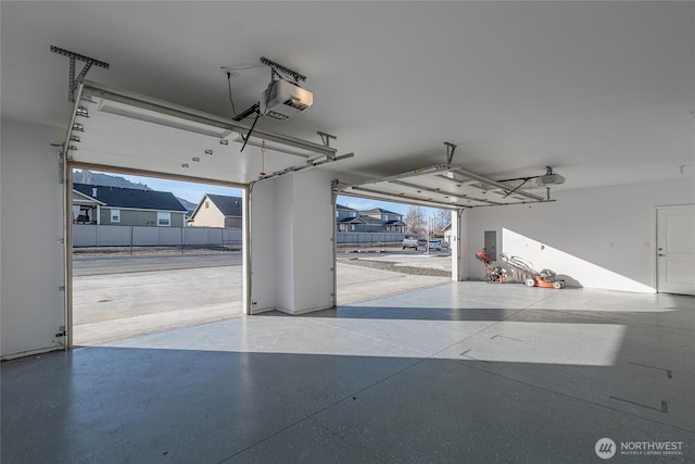 garage featuring a garage door opener