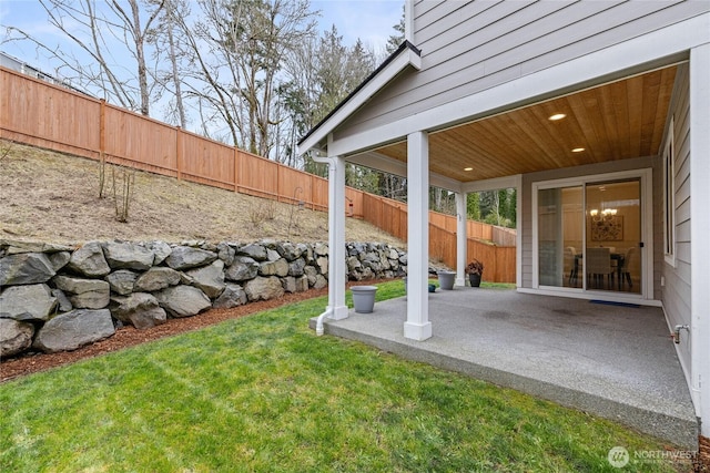 view of yard with a patio area and a fenced backyard