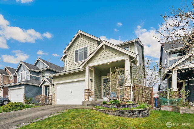 8107 165th Street Ct E, Puyallup, WA 98375 - view of front facade featuring stone siding, a front lawn, aphalt driveway, and an attached garage
