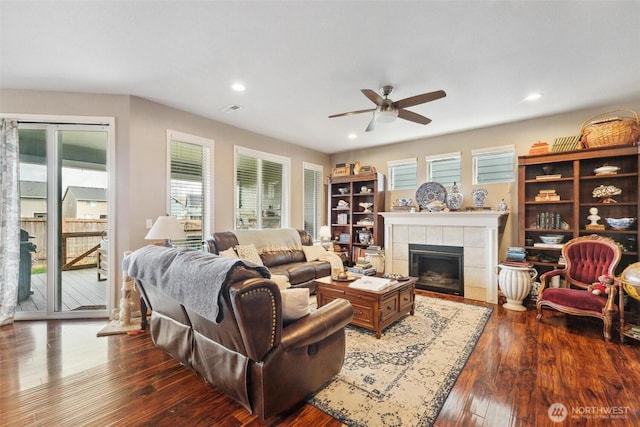 8107 165th Street Ct E, Puyallup, WA 98375 - living room featuring a fireplace, wood finished floors, visible vents, ceiling fan, and recessed lighting
