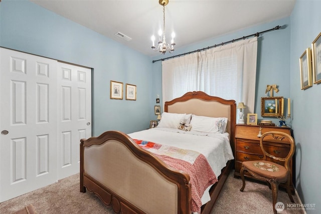8107 165th Street Ct E, Puyallup, WA 98375 - bedroom with visible vents, a closet, carpet, and an inviting chandelier
