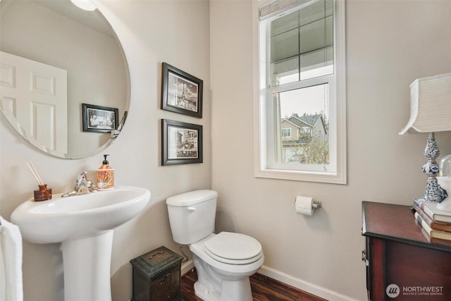 8107 165th Street Ct E, Puyallup, WA 98375 - bathroom with toilet, a sink, baseboards, and wood finished floors