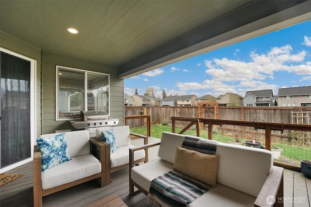 8107 165th Street Ct E, Puyallup, WA 98375 - wooden deck with a fenced backyard, an outdoor living space, and a residential view