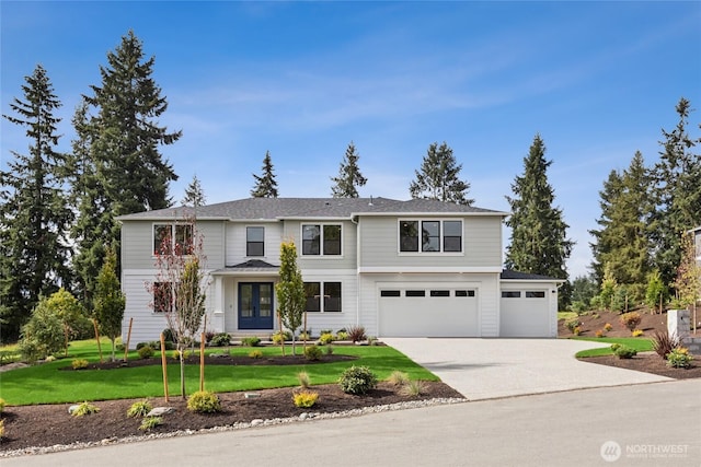 traditional-style house with a garage, french doors, concrete driveway, and a front lawn