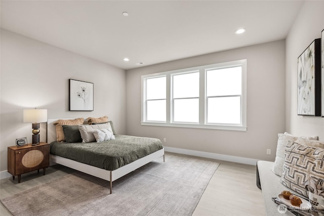 bedroom with light wood-style flooring, recessed lighting, and baseboards