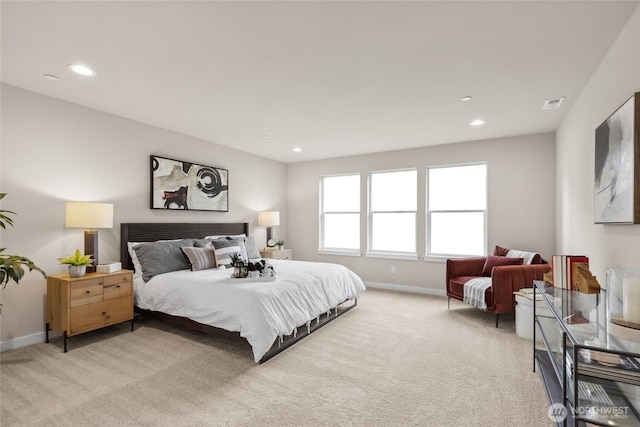 bedroom with light carpet, visible vents, recessed lighting, and baseboards