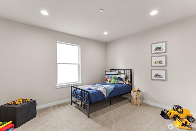 carpeted bedroom featuring recessed lighting and baseboards