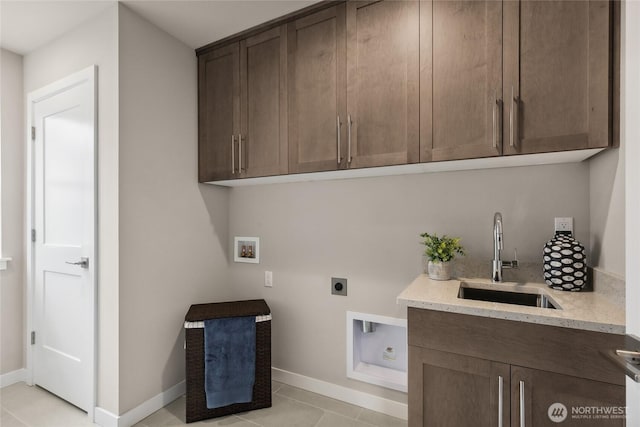 laundry area with baseboards, hookup for a washing machine, cabinet space, electric dryer hookup, and a sink