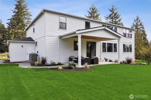 view of front of property with a patio area, central AC unit, an outdoor living space, and a front yard