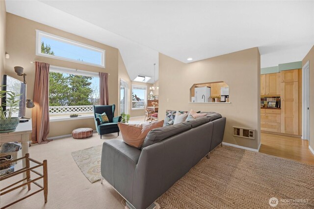 living room featuring recessed lighting and light colored carpet