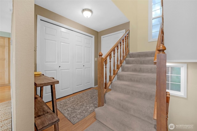 entryway with stairs and wood finished floors