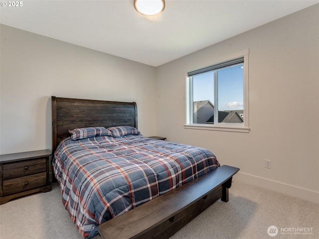 bedroom with carpet and baseboards