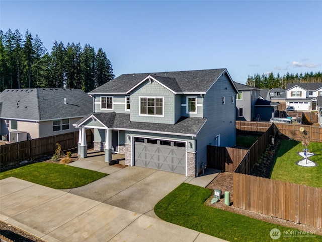2840 SE 20th Ave, Battle Ground, WA 98604 - view of front of house with an attached garage, concrete driveway, stone siding, roof with shingles, and a residential view