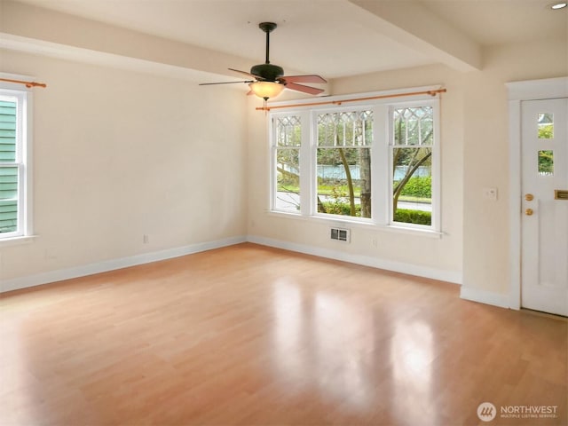 entrance foyer with plenty of natural light, visible vents, and light wood-type flooring