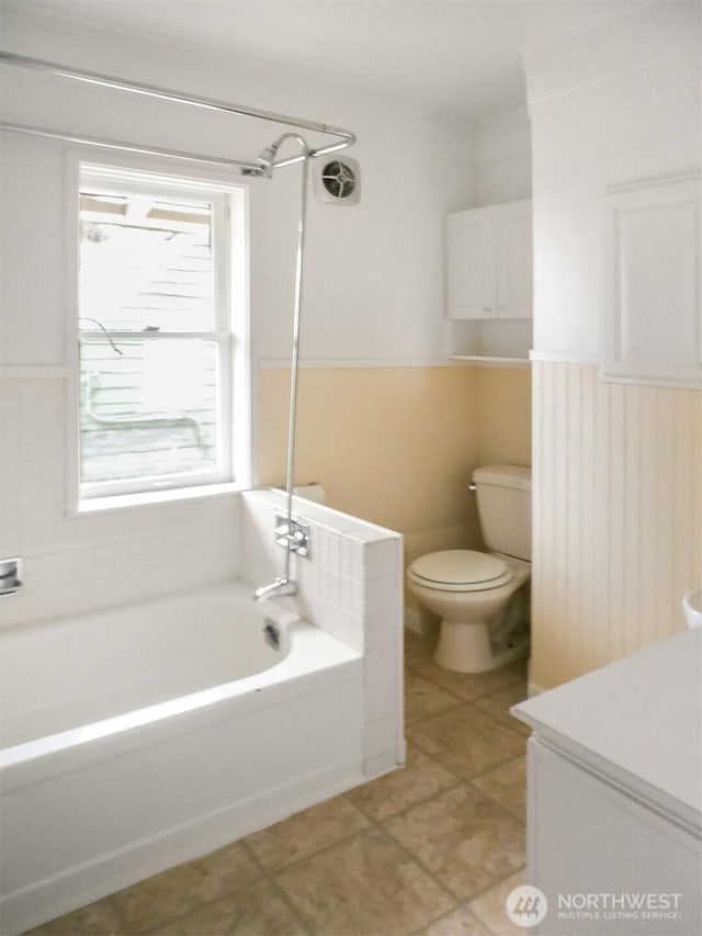 full bathroom with toilet and vanity