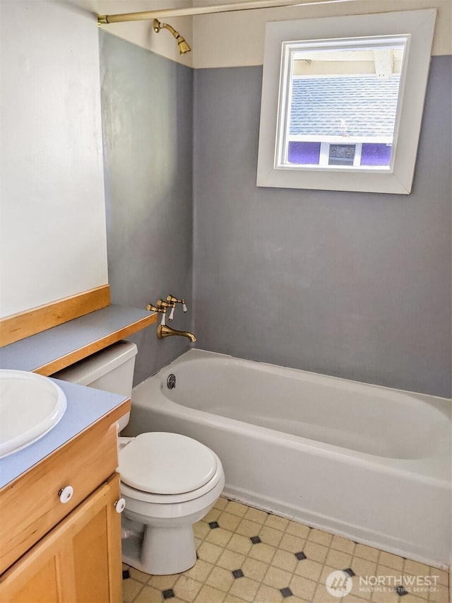 bathroom featuring toilet and vanity