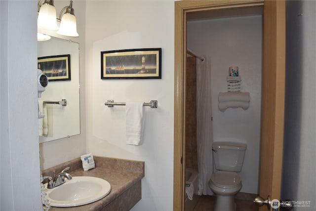 bathroom featuring tub / shower combination, toilet, and vanity