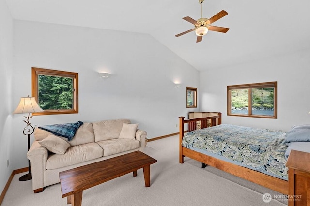 carpeted bedroom with lofted ceiling, a ceiling fan, and baseboards