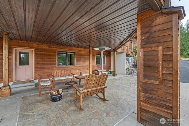 view of patio with an outdoor fire pit