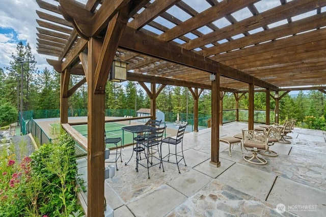 view of patio featuring fence and a pergola