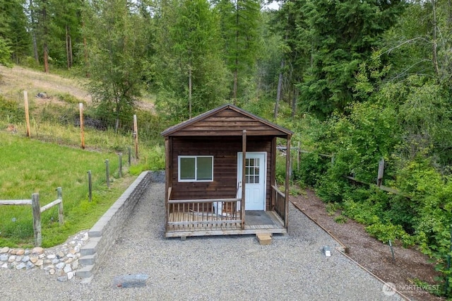 view of outdoor structure featuring an outdoor structure and a wooded view