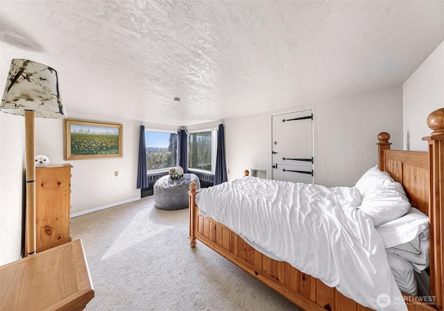 307 W Highland Dr, Seattle, WA 98119 - bedroom featuring light colored carpet, a textured ceiling, and baseboards