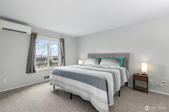 carpeted bedroom featuring visible vents, a textured ceiling, baseboards, and a wall unit AC