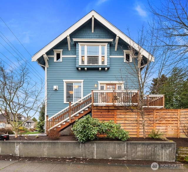 view of front facade with stairs and a deck