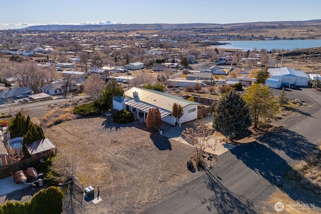 bird's eye view featuring a water and mountain view