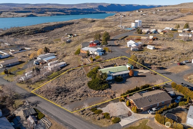 bird's eye view featuring a water and mountain view