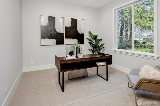 home office with baseboards, carpet floors, and a healthy amount of sunlight