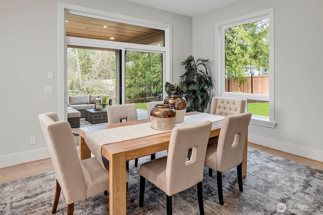 dining area featuring recessed lighting, baseboards, and wood finished floors