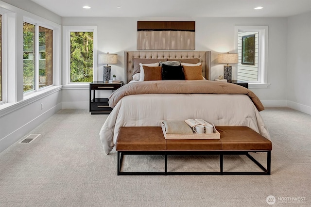 carpeted bedroom with recessed lighting, baseboards, and visible vents